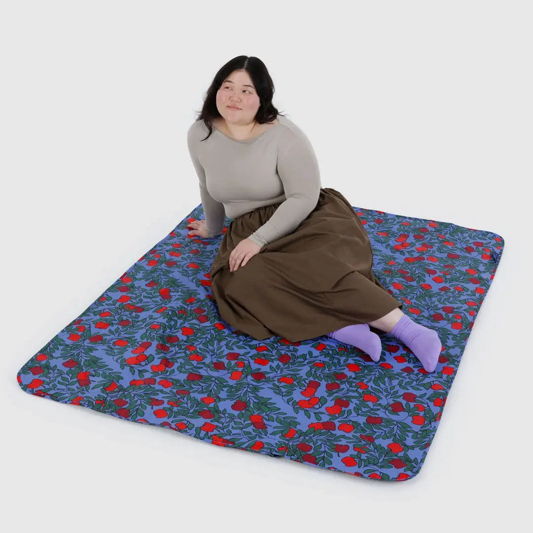 Puffy Picnic Blanket in Candy Apple, model on blanket to show size